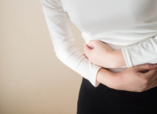 woman in pain with cramps from IBS